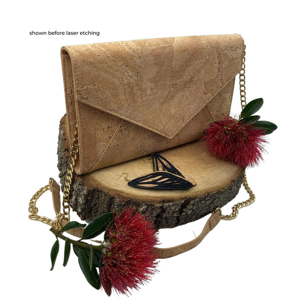 The perfect, natural eco cork handbag to complete many of your outfits. Styled in a timeless classic envelope clutch design with a stunning butterfly etch. This vegan-friendly bag will look equally great on a night on the town, a day at the races, a family wedding or even to the office.