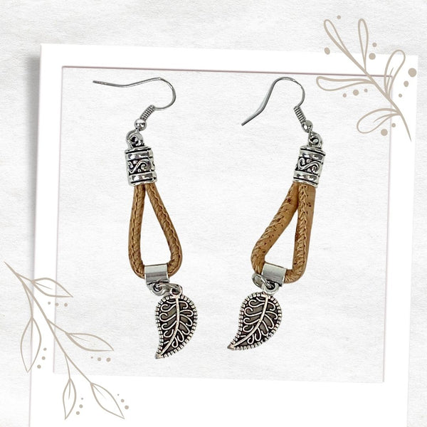 Delicate and pretty. Exquisite and stylish. These lightweight cork dropper earrings will finish off any outfit, taking it from great to WOW! From workday to playtime these earrings will effortlessly add that "je nais se quois" to your look. Featuring eco, vegan-friendly cork and a filigree leaf, set off with an intricate silver-coloured finding. The compliments are sure to come your way!