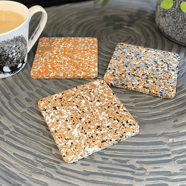 Introducing the Cork and Sole coasters x 4. Innovative designed coasters made from cork pieces and upcycled jandal soles.  Eco, flexible, hardwearing, easy wipe clean and stylish to boot!  Give as a gift or treat yourself! One pack of 4 won't be enough!  Available in 3 colour ways  Blue/Black  Black/White  Orange/White