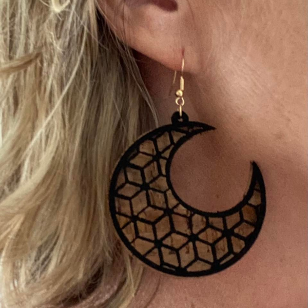 Eco cork earrings in moon shape. Intricate cut out detail.