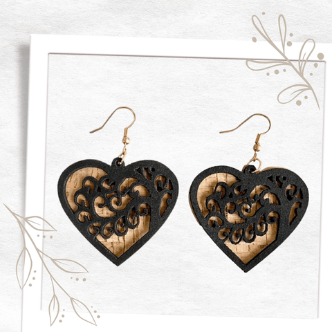 These distinctive eco-fashion cork earrings are sure to wow! Featuring two cork laser-cut hearts the solid base colour is a natural cork colour, highlighted by an intricate, delicate heart design in black. Super lightweight, you will forget you are wearing them until the compliments flood in! Statement eco, sustainable cork earrings that are going to grab attention. 