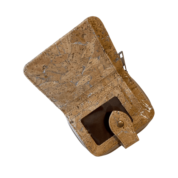 This perfectly sized natural vegan-friendly cork purse with silver-coloured flashes throughout is neither too big nor too small! Featuring 3 designated card pockets and an additional 4 spaces for extra cards, including the all-important clear ID slot.